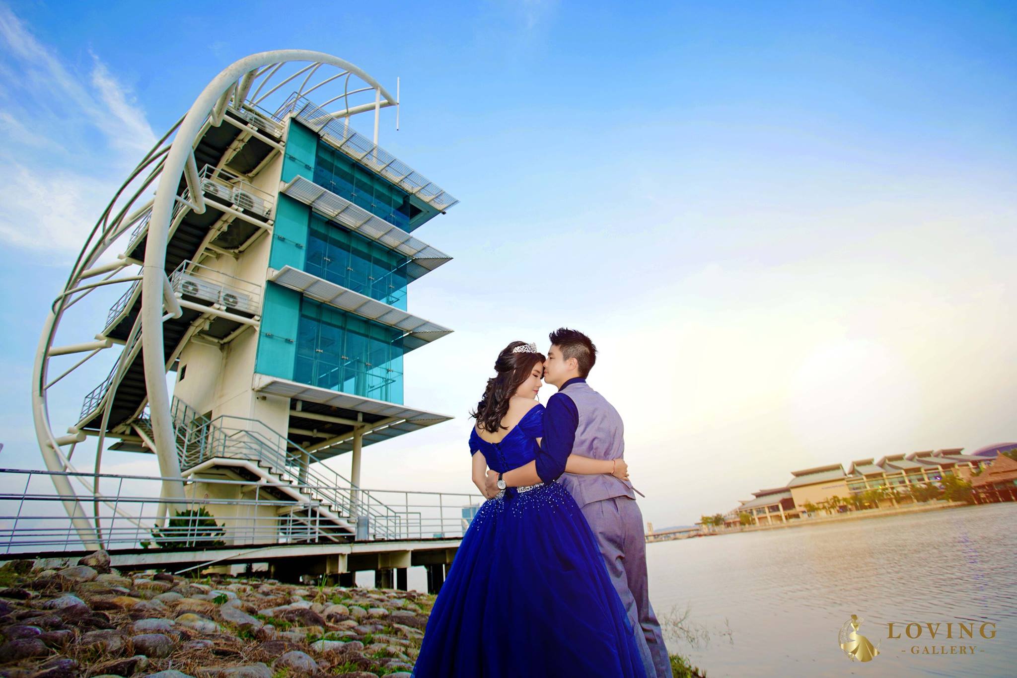 Beautiful architecture by the lake at Putrajaya. Loving Gallery. Tiara & navy blue ballgown.